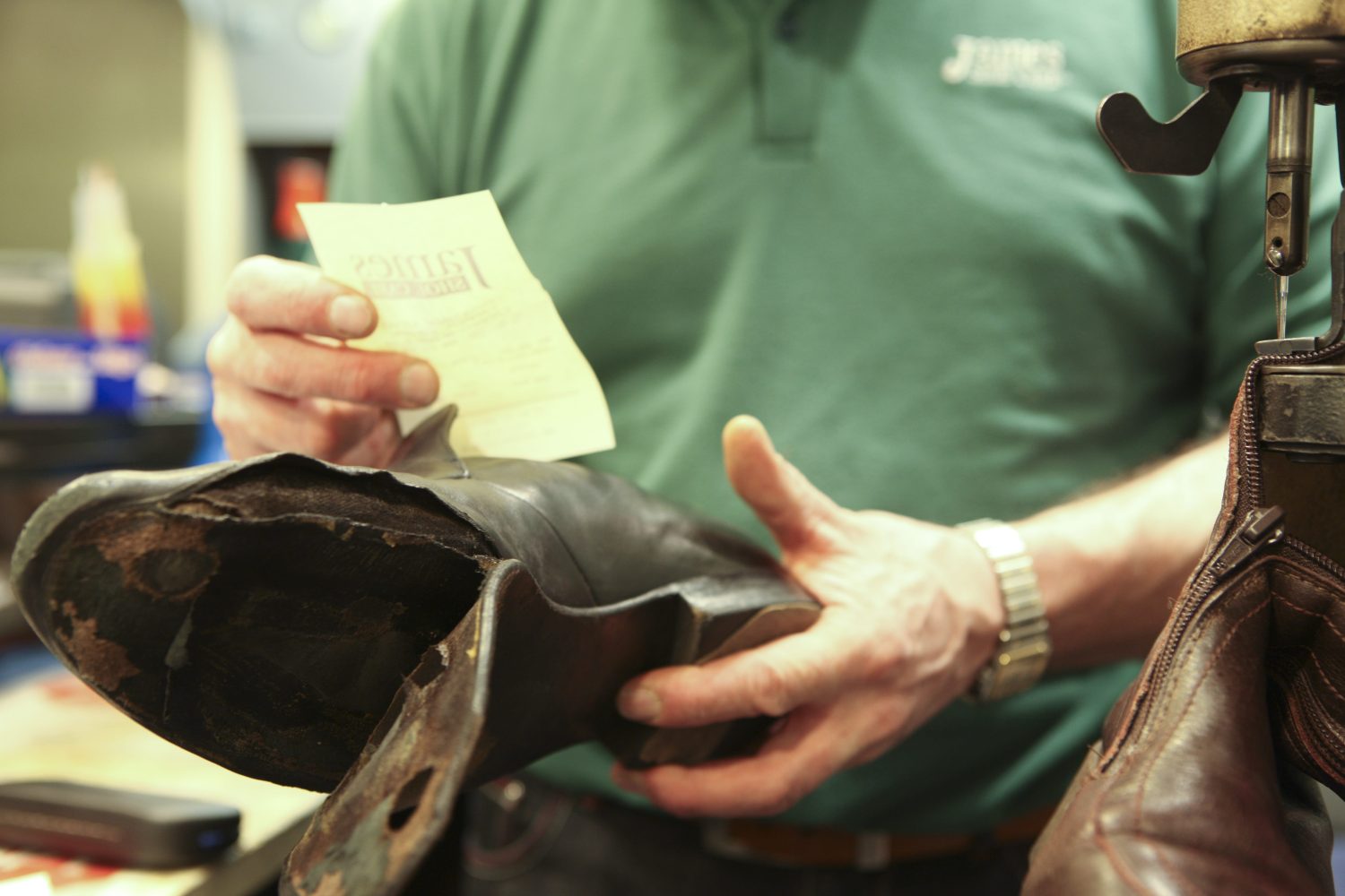 A worn boot read against the repair ticket